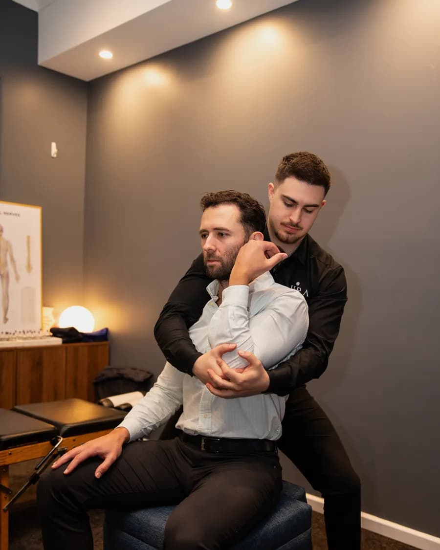 A person's neck and shoulders, the line where posture is carried