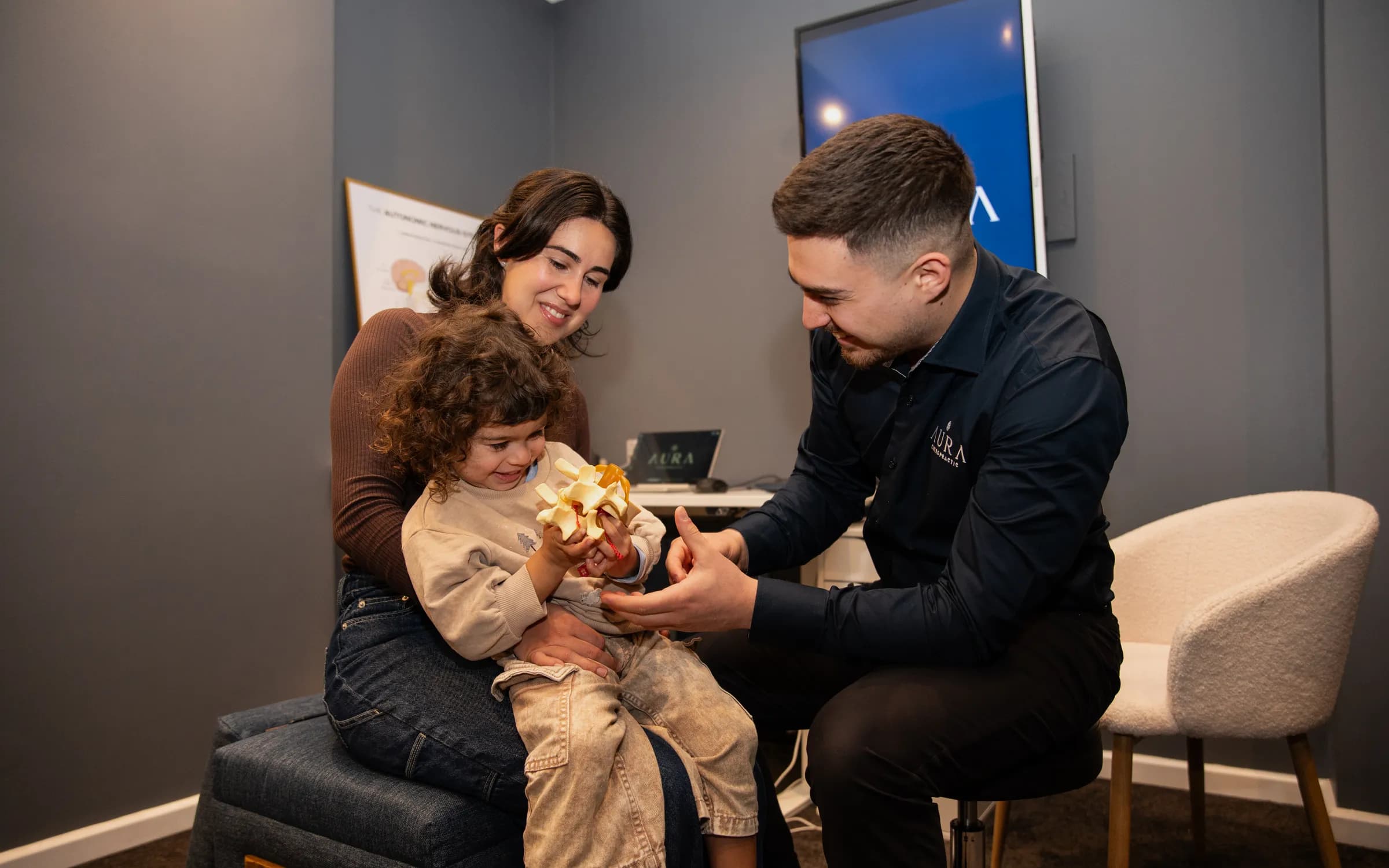 A family at Aura Chiropractic in Toorak